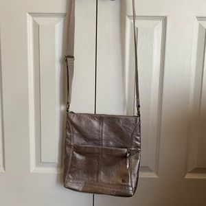The Sak metallic rose gold cross body bag
